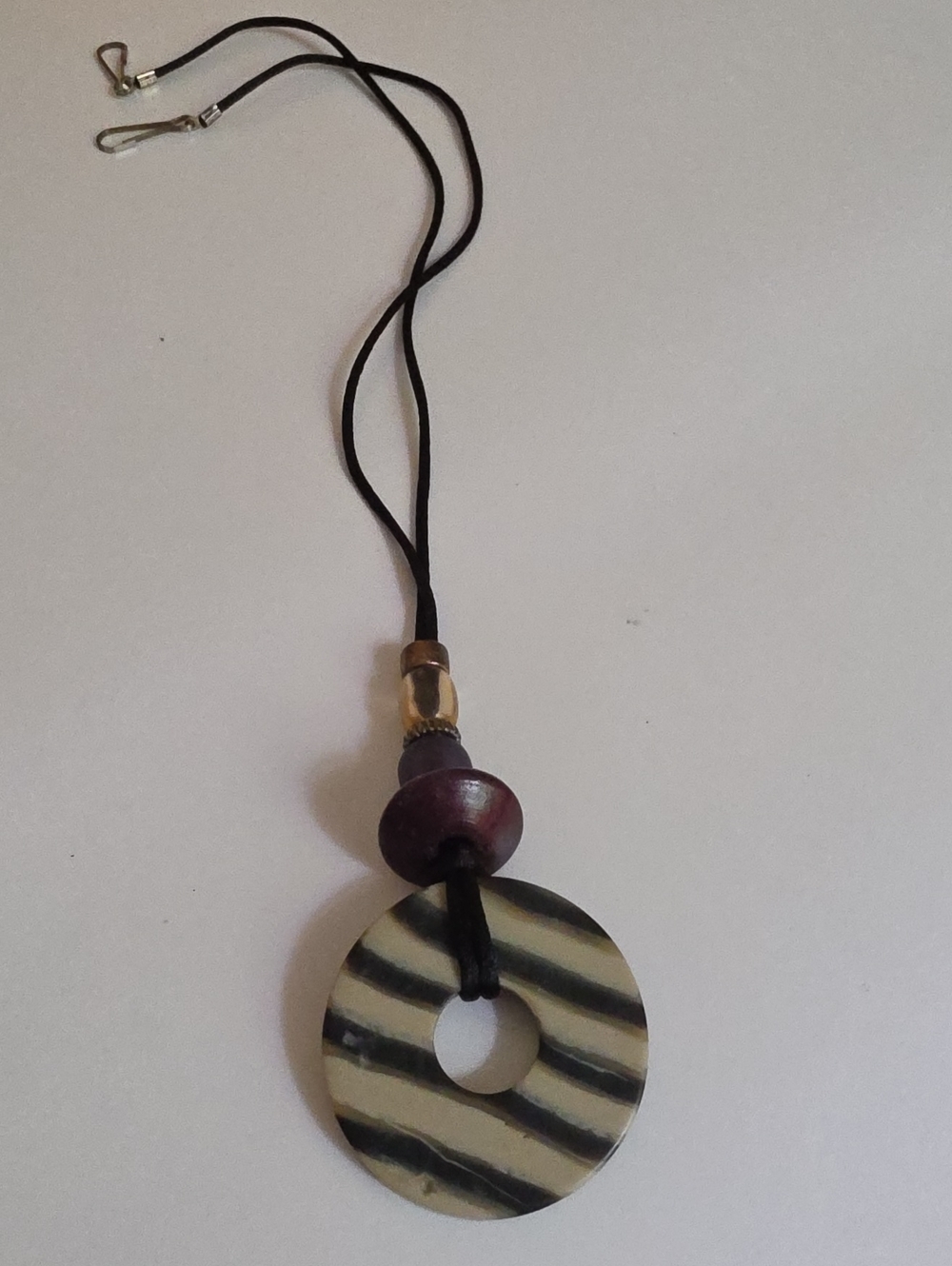 Handcrafted Black and Cream Donut Pendant Necklace On Cord